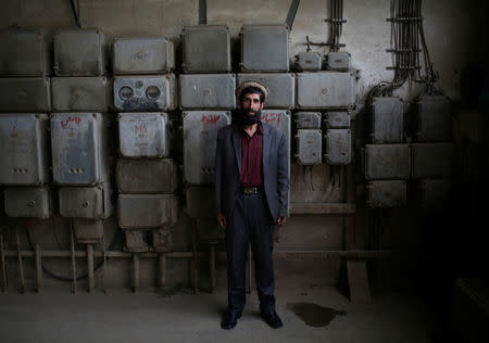 Fazil Haq, 50, an employee at the Jabal Saraj cement factory, poses for a photograph in Jabal Saraj, north of Kabul, Afghanistan April 19, 2016. REUTERS/Ahmad Masood