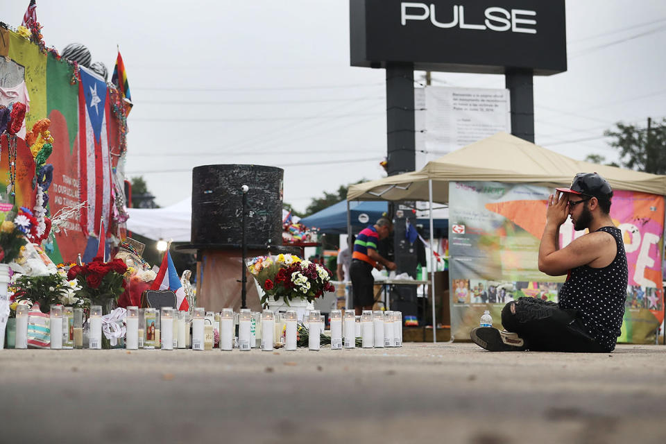 <p>Jose Ramirez who survived the mass shooting at the Pulse gay nightclub reacts as he visits the site one year after the shooting on June 12, 2017 in Orlando, Florida. (Joe Raedle/Getty Images) </p>