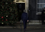 Britain's Prime Minister Theresa May leaves after a speech outside 10 Downing Street in London, Wednesday, Dec. 12, 2018. British Prime Minister Theresa May survived a brush with political mortality Wednesday, winning a no-confidence vote of her Conservative lawmakers that would have ended her leadership of party and country. (AP Photo/Matt Dunham)