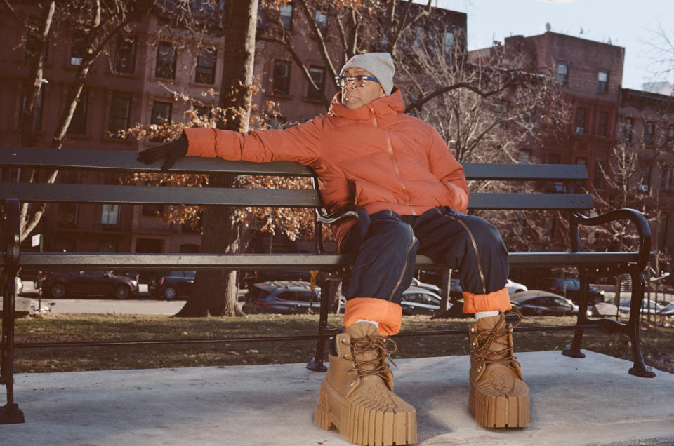 Spike Lee in Mschf 2x4 boots on a park bench.