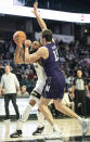 Wake Forest forward Dallas Walton (13) is pressured by Northwestern center Ryan Young (15) in the first half of an NCAA college basketball game on Tuesday, Nov. 30, 2021, at the Joel Coliseum in Winston-Salem, N.C. (Allison Lee Isley/The Winston-Salem Journal via AP)