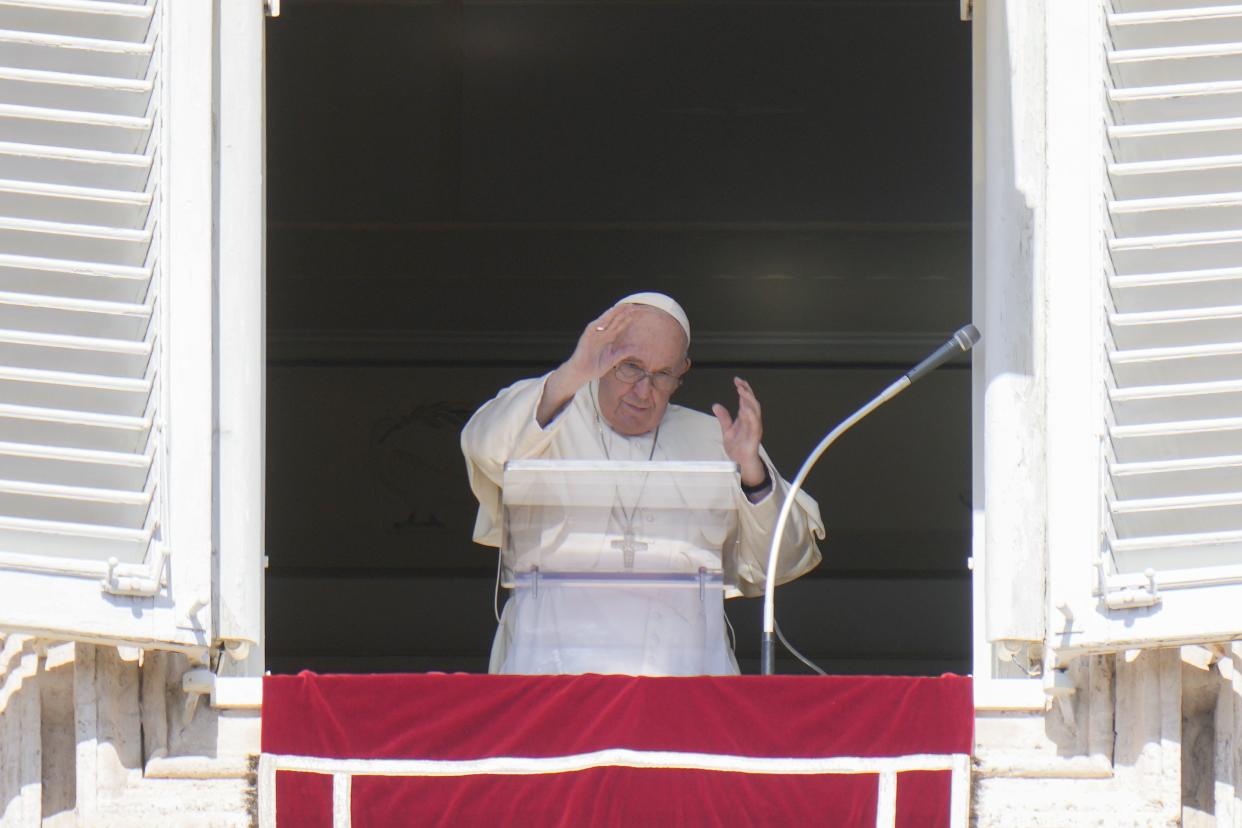 Pope Francis waves during the Angelus noon prayer from the window of his studio overlooking St.Peter's Square, at the Vatican, Sunday, Oct. 2, 2022. Pope Francis has appealed to Russian President Vladimir Putin, imploring him to "stop this spiral of violence and death" in Ukraine. The pontiff also called on Ukrainian President Volodymyr Zelenskyy to "be open" to serious peace proposals.