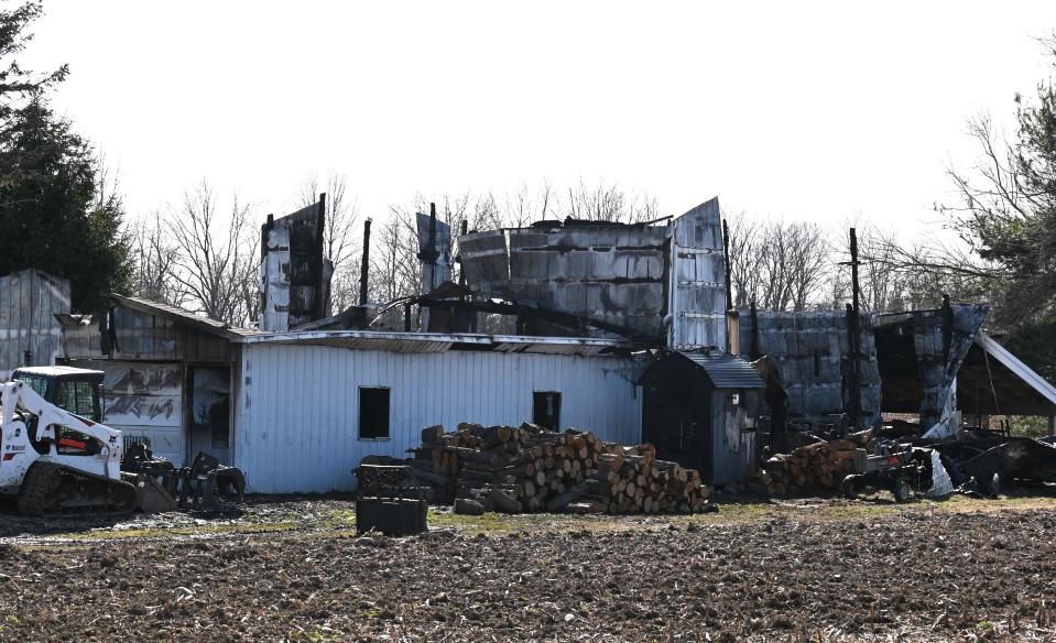 Firefighters were able to keep the Thursday night blaze from spreading to the nearby home from this pole barn at 674 Farrand Road.