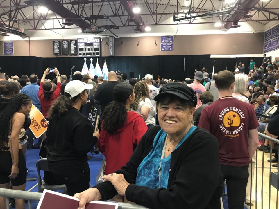 Carol Lanzotti poses for a photo as she waits for Former President Barack Obama to speak at a rally at Cesar Chavez High School on Nov. 2, 2022.