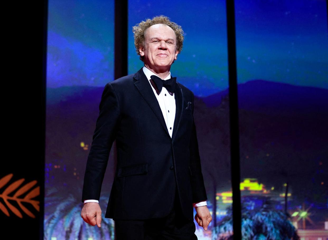 john c reilly on stage during the closing ceremony at cannes 76th festival