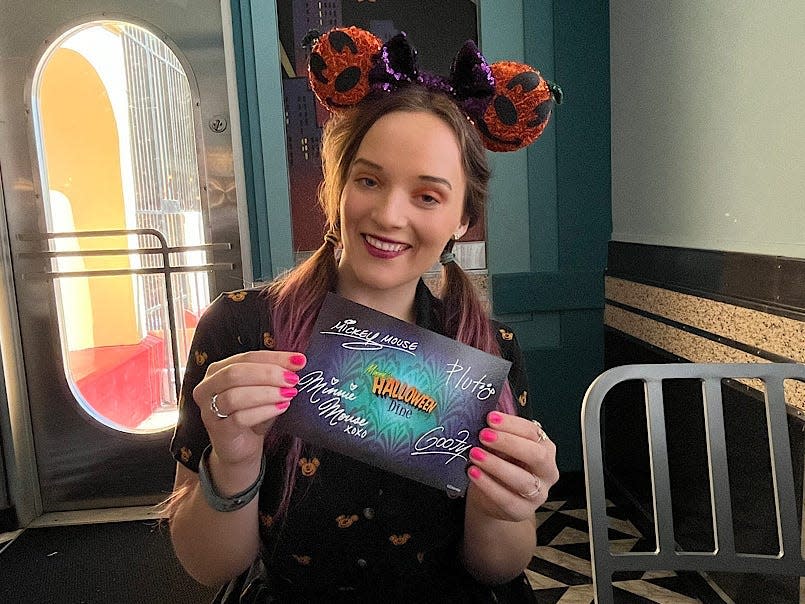 jenna posing with a signed character card from hollywood and vine