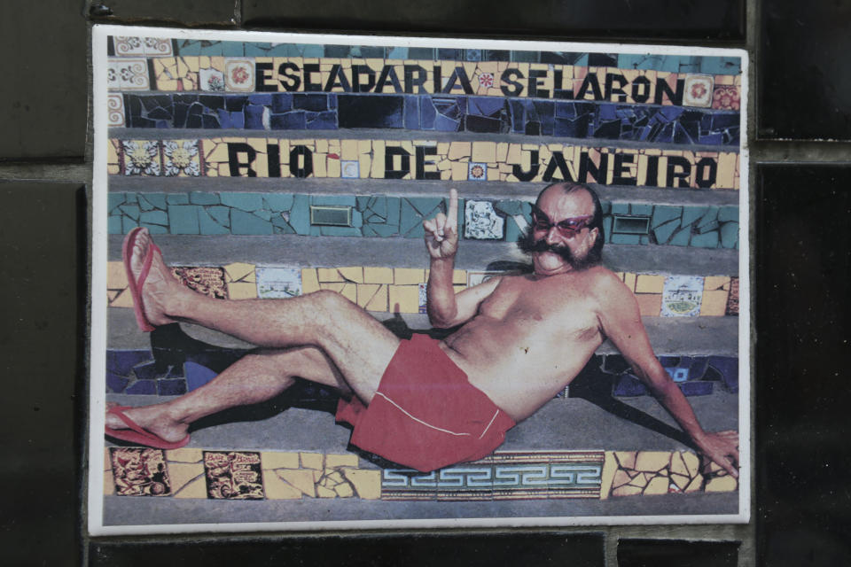 An undated photo of Chilean artist Jorge Selaron decorates a tile that is part of a wall on a public staircase he decorated and titled the "Selaron Stairway" in Rio de Janeiro, Brazil, Thursday, Jan. 10, 2013. Selaron, an eccentric Chilean artist and longtime Rio resident who created a massive, colorful tile stairway in the bohemian Lapa district that's popular with tourists, was found dead on the stairway on Thursday. Authorities are investigating the cause of death. (AP Photo)
