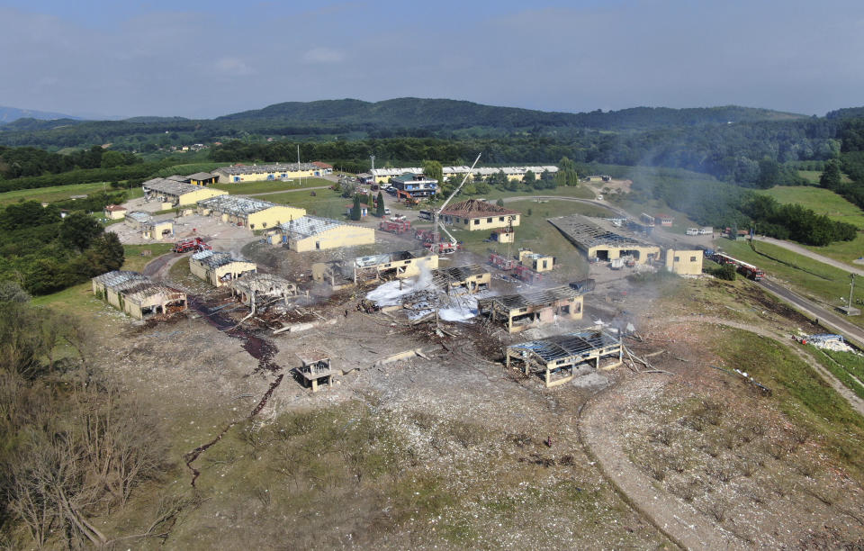 A view of destroyed buildings at a fireworks factory following a fire after an explosion outside the town of Hendek, Sakarya province, northwestern Turkey, Friday, July 3, 2020. There were an estimated 150 workers at the factory, Gov. Cetin Oktay Kaldirim told state-run Anadolu Agency. Several firefighters and ambulances were sent to the factory, which is away from residential areas. However, explosions were continuing, hampering efforts to bring the fire under control.The cause of the blast wasn't immediately known. (DHA via AP)