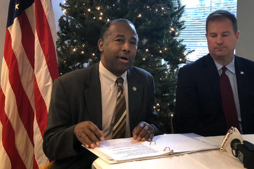 Housing and Urban Development Secretary Ben Carson, left, takes questions from reporters Tuesday, Nov. 12, 2019, as Deputy Secretary of the Department of Veterans Affairs James Byrne, right, looks on during a news conference, in Manchester, N.H. Carson told reporters Tuesday that the numbers of veterans who are homeless fell between 2018 and 2019. (AP Photo/Michael Casey)