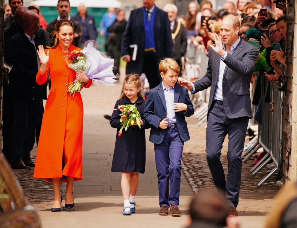 The Duke and Duchess of Cambridge and Prince George and Princess Charlotte speak to well-wishers during their visit to Cardiff Castle in June (PA) (PA Wire)