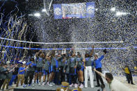 Kentucky players and coaches celebrate after beating South Carolina to win the NCAA women's college basketball Southeastern Conference tournament championship game Sunday, March 6, 2022, in Nashville, Tenn. (AP Photo/Mark Humphrey)