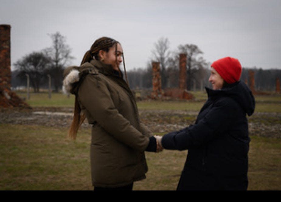 Brown University junior Naomi Umlauf with her Holocaust survivor grandmother, Eva Umlauf, at Auschwitz on Jan. 27, 2023, the 78th anniversary of the camp's liberation.