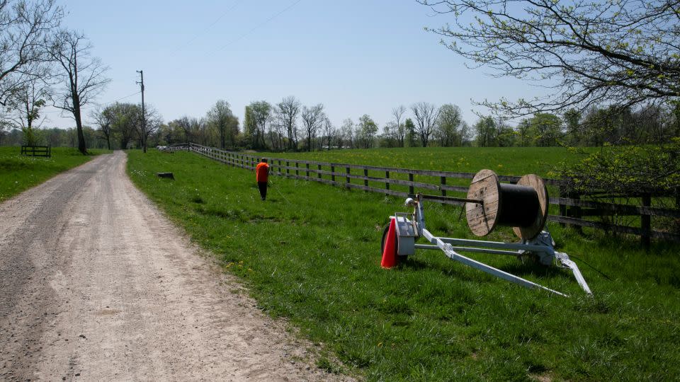 Broadband is installed in Kentucky. Dave Wallace, an employee of Silica Broadband, pulls fiber to install internet in Louisville, Kentucky, U.S., April 19, 2021. - Amira Karaoud/Reuters/File