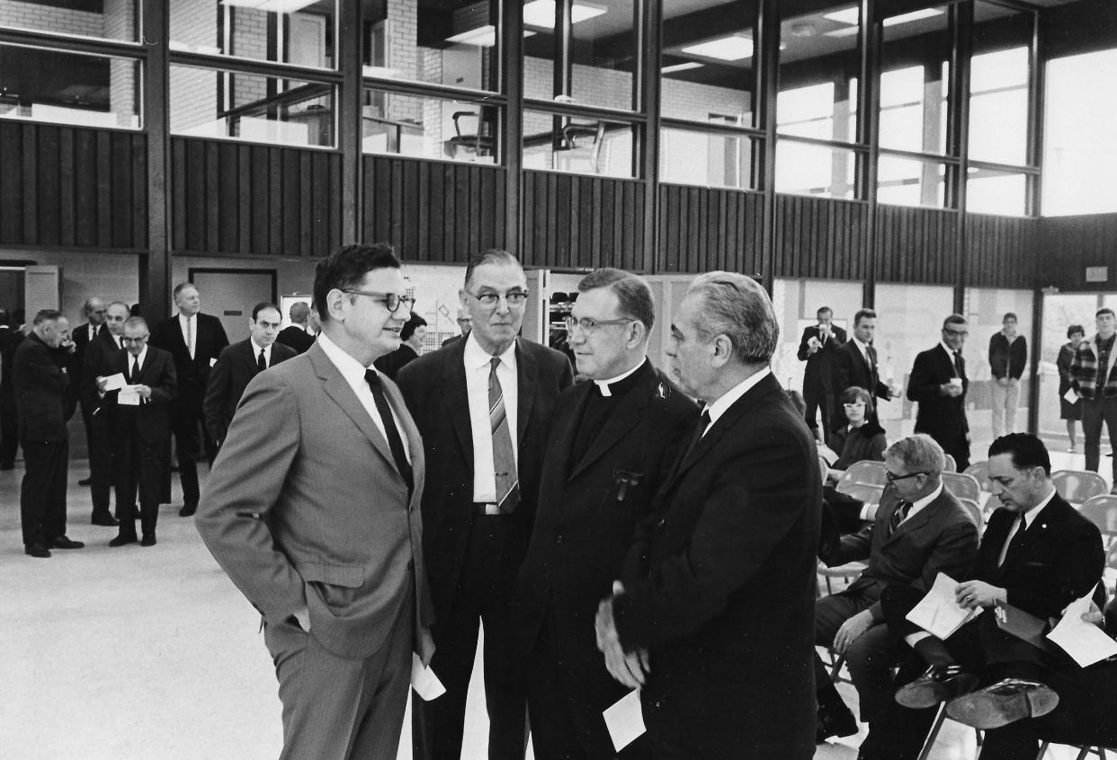 Akron Mayor John S. Ballard, left, chats with Council President Ralph Turner, the Rev. Frederick B. Mohan, pastor of St. Martha Catholic Church, and Councilman Joseph Costello at the dedication of Patterson Park Community Center on Nov. 24, 1967.