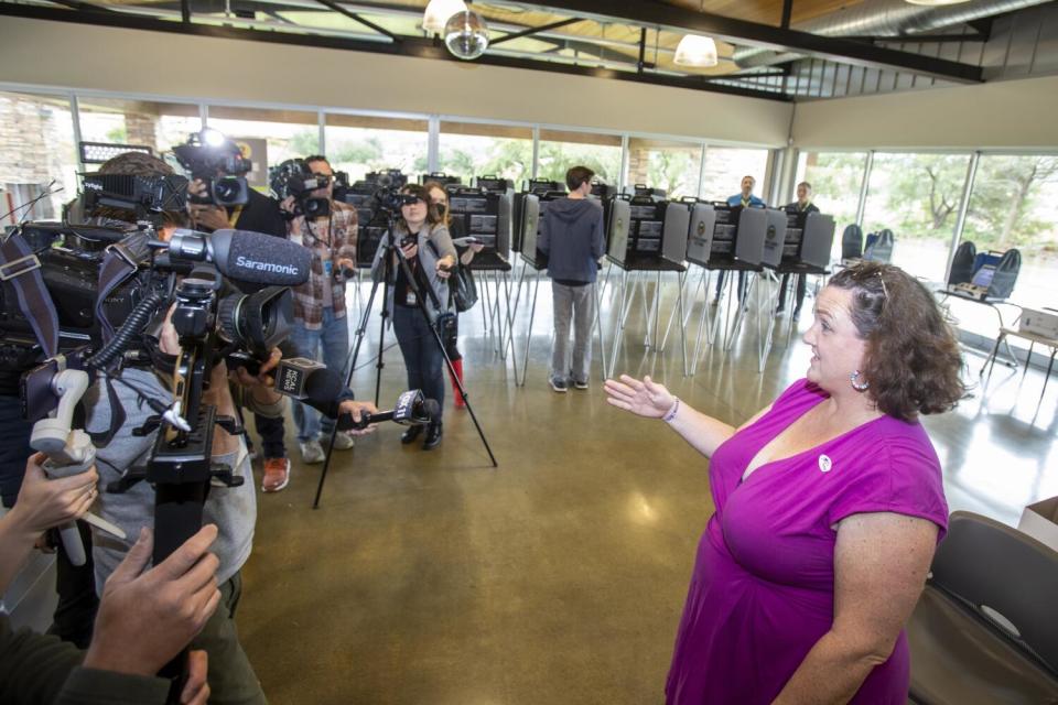 Rep. Katie Porter talks to reporters