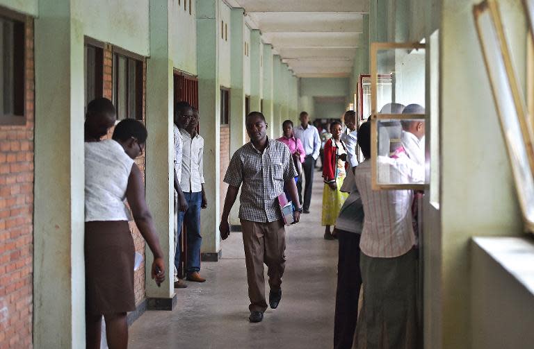 Serge Claver Nzisabira (C), seen at Burundi University in Bujumbura