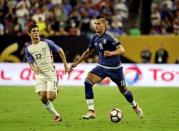 Jun 21, 2016; Houston, TX, USA; Argentina forward Erik Lamela (18) dribbles the ball as United States midfielder Christian Pulisic (17) chases during the second half in the semifinals of the 2016 Copa America Centenario soccer tournament at NRG Stadium. Kevin Jairaj-USA TODAY Sports