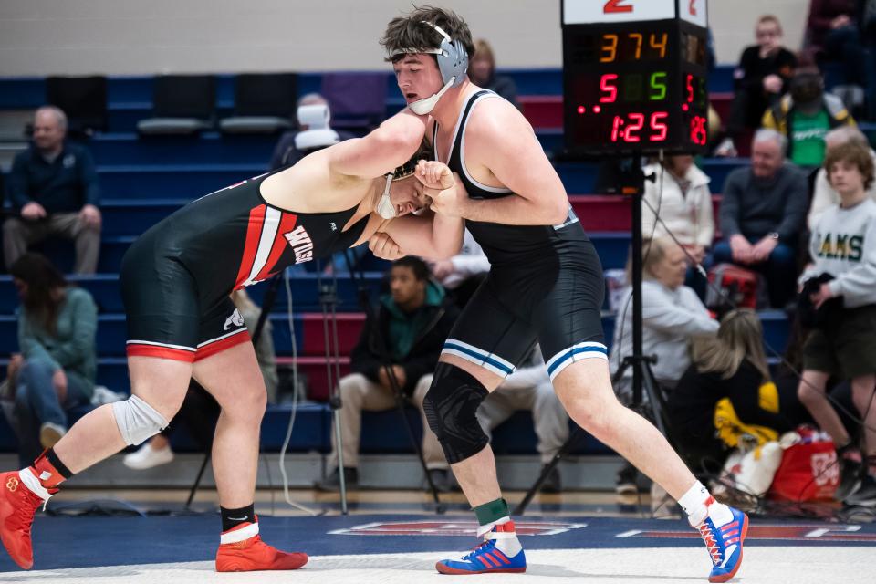 Chambersburg's Aiden Hight (right) wrestles Wilson's Ryan McMillan in the 215-pound championship bout at the PIAA District 3 Class 3A Wrestling Championships at Spring Grove Area High School on Saturday, Feb. 24, 2024, in Jackson Township.