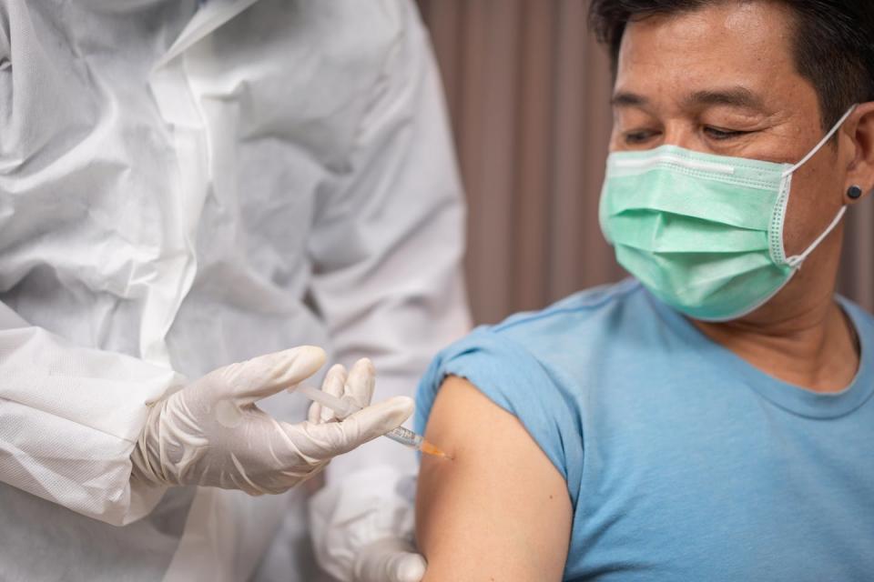 Male patient getting vaccinated.