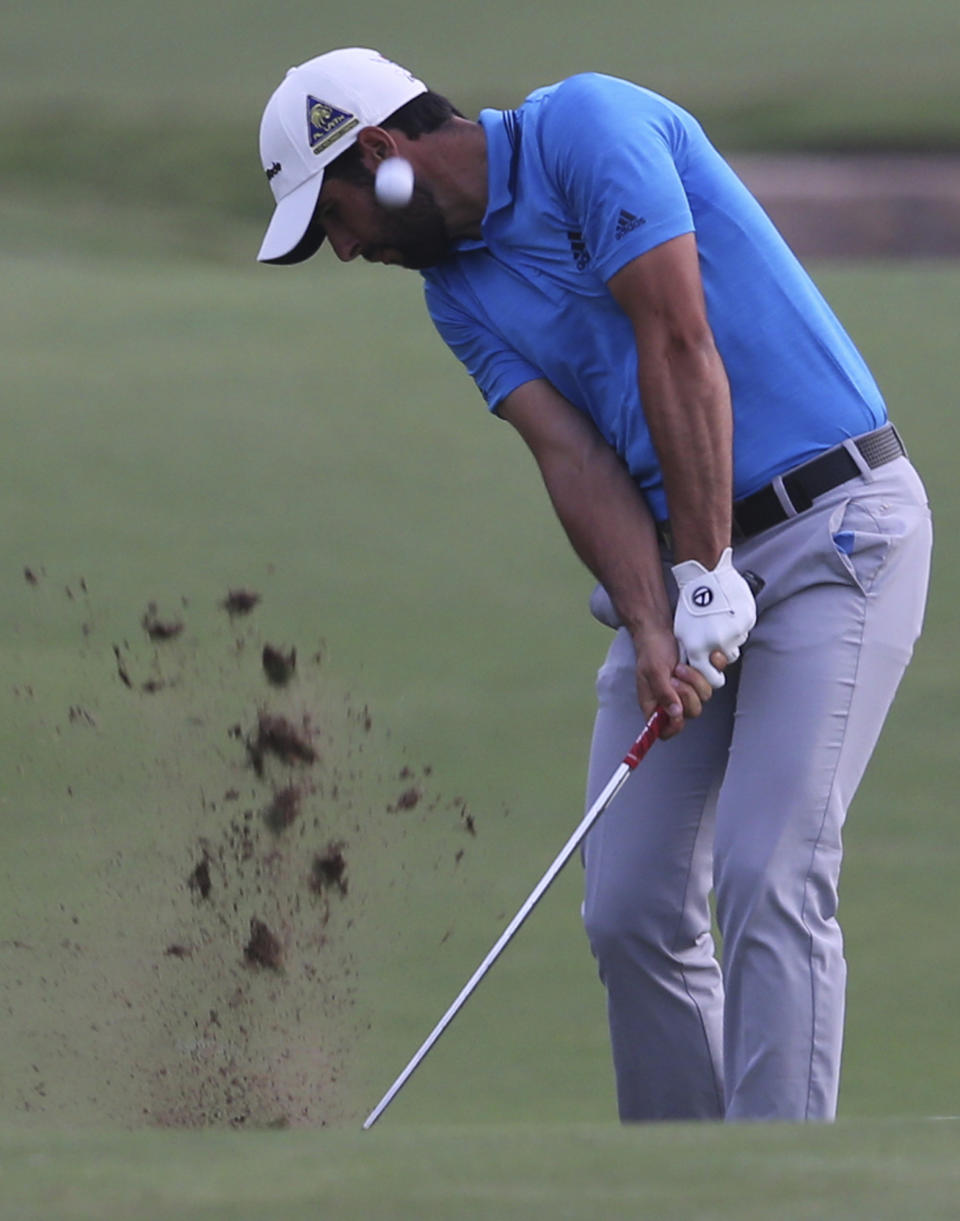 Spain's Adrian Otaegui plays a shot on the 18th hole during the second round of the DP World Tour Championship golf tournament in Dubai, United Arab Emirates, Friday, Nov. 16, 2018. (AP Photo/Kamran Jebreili)