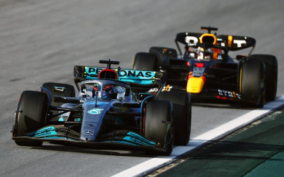 George Russell of Great Britain driving the (63) Mercedes AMG Petronas F1 Team W13 leads Max Verstappen of the Netherlands driving the (1) Oracle Red Bull Racing RB18 during the Sprint ahead of the F1 Grand Prix of Brazil at Autodromo Jose Carlos Pace on November 12, 2022 in Sao Paulo, Brazil - Chris Graythen/Getty Images