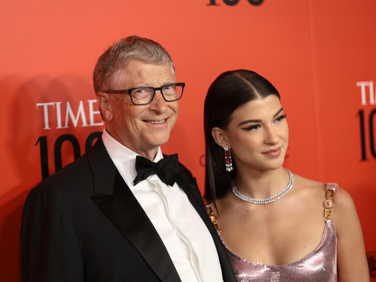 Bill Gates and Phoebe Gates in formal attire standing next to each other and posing for a photo.