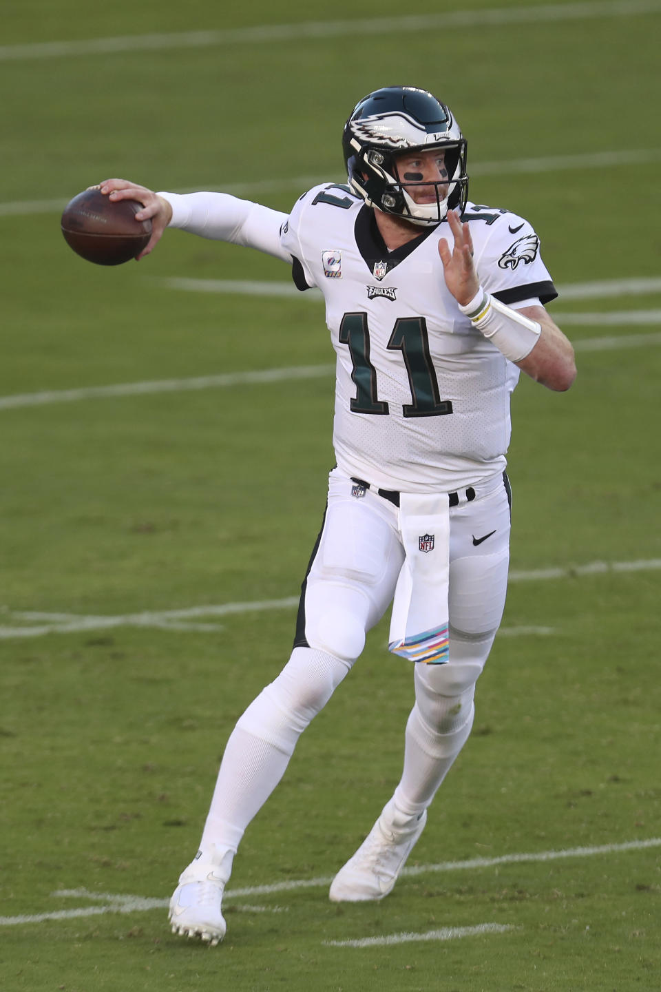 Philadelphia Eagles quarterback Carson Wentz (11) passes against the San Francisco 49ers during the first half of an NFL football game in Santa Clara, Calif., Sunday, Oct. 4, 2020. (AP Photo/Jed Jacobsohn)