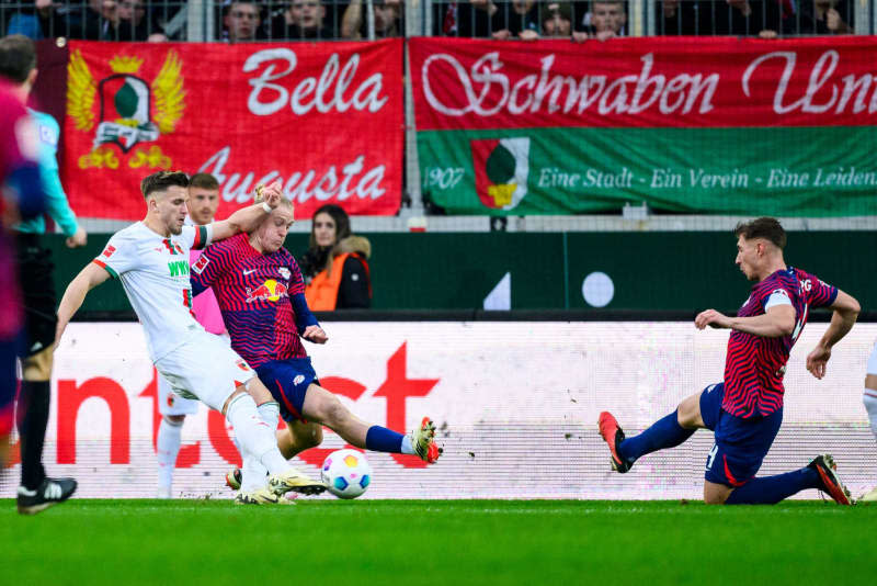 Augsburg's Ermedin Demirovic (L) scores his side's second goal of the game during the German Bundesliga soccer match between FC Augsburg and RB Leipzig at WWK-Arena. Tom Weller/dpa