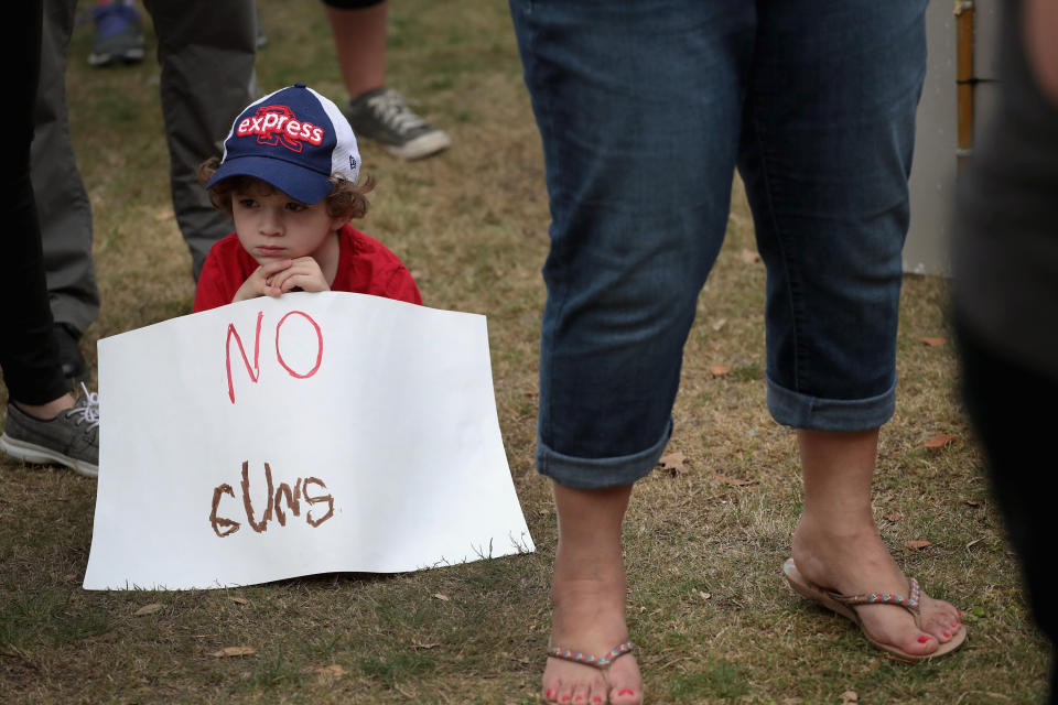 =Ryan Price, 6, participates in a March for Our Lives rally on March 24, 2018 in Round Rock, Texas. More than 800 March for Our Lives events, organized by survivors of the Parkland, Florida school shooting. (Photo: Scott Olson via Getty Images)