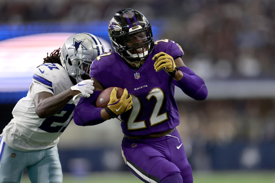 Baltimore Ravens running back Derrick Henry (22) rushes for a touchdown as Dallas Cowboys' Caelen Carson (21) defends in the second half of an NFL football game in Arlington, Texas, Sunday, Sept. 22, 2024. (AP Photo/Gareth Patterson)