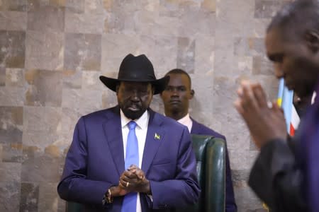 South Sudan's President Salva Kiir Mayardit prays before his meeting with ex-vice president and former rebel leader Riek Machar in Juba