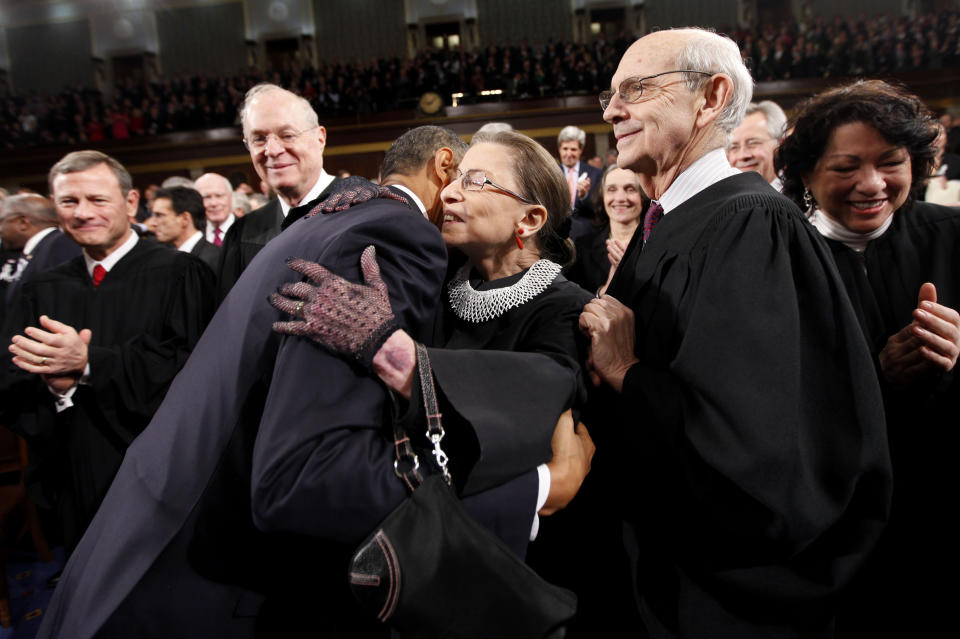 FILE - In this Jan. 25, 2011, file photo, President Barack Obama hugs Supreme Court Justice Ruth Bader Ginsburg on Capitol Hill in Washington, prior to delivering his State of the Union address. From left are, Chief Justice John Roberts, Justice Anthony Kennedy, Obama, Ginsburg, Justice Stephen Breyer and Justice Sonia Sotomayor. Ginsburg died at her home in Washington, on Sept. 18, 2020, the Supreme Court announced. (AP Photo/Pablo Martinez Monsivais, Pool, File)