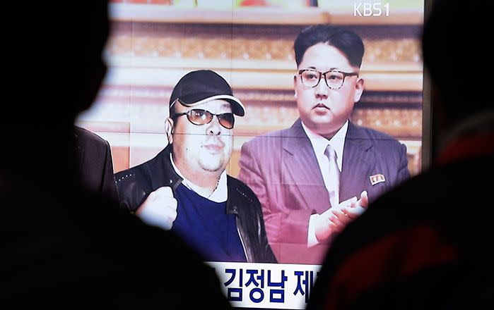 A TV screen shows pictures of North Korean leader Kim Jong-un and his older brother Kim Jong-nam, left, at the Seoul Railway Station in Seoul, South Korea. Source: AAP