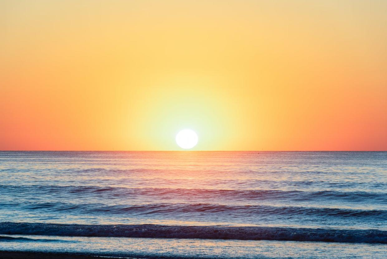 <span class="caption">Sunrise in Stone Harbor, New Jersey.</span> <span class="attribution"><a class="link " href="https://www.gettyimages.com/detail/photo/summer-sunrise-royalty-free-image/1171419055" rel="nofollow noopener" target="_blank" data-ylk="slk:Robert D. Barnes via Getty Images;elm:context_link;itc:0;sec:content-canvas">Robert D. Barnes via Getty Images</a></span>