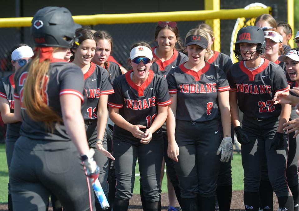 The West Allegheny Indians greet teammate Emily Nolan after she hit a home run during Monday's WPIAL Class 5A playoff game against Fox Chapel at Montour High School.