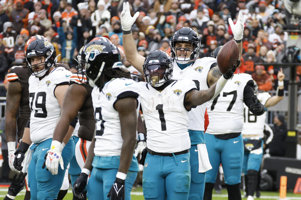 Jacksonville Jaguars running back Travis Etienne Jr. (1) reacts after his 1-yard rushing touchdown during the second half of an NFL football game against the Cleveland Browns, Sunday, Dec. 10, 2023, in Cleveland. (AP Photo/Ron Schwane)