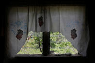 <p>Curtains are seen hanging from a home at Codrington on the island of Barbuda just after a month after Hurricane Irma struck the Caribbean islands of Antigua and Barbuda, October 7, 2017. REUTERS/Shannon Stapleton </p>