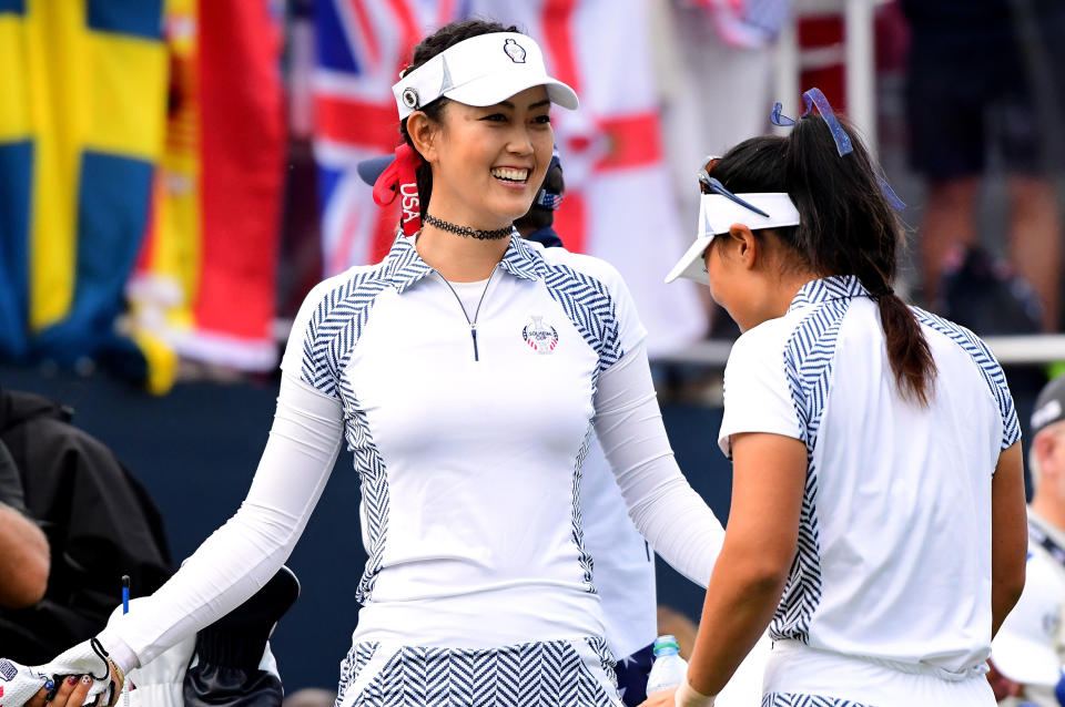 Michelle Wie and Danielle Kang of Team USA dance on the first tee during the morning foursomes matches of the Solheim Cup at the Des Moines Golf and Country Club on August 19, 2017 in West Des Moines, Iowa. (Photo by Harry How/Getty Images)