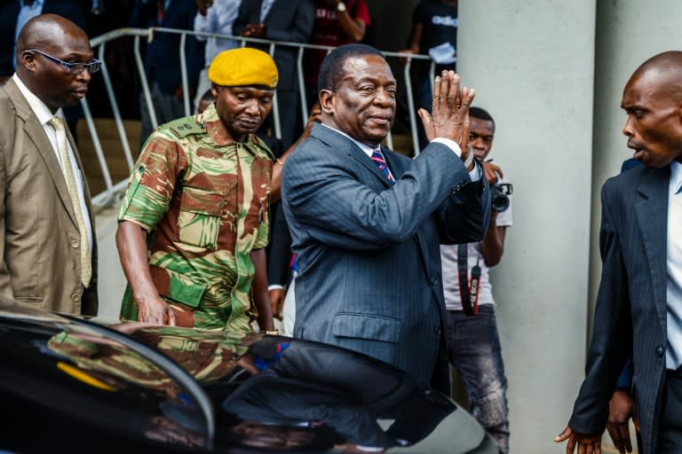 Zimbabwe's President Emmerson Mnangagwa arrives for a visit at the home of late opposition leader Morgan Tsvangirai, who died in South Africa last week, to express his condolences to the family