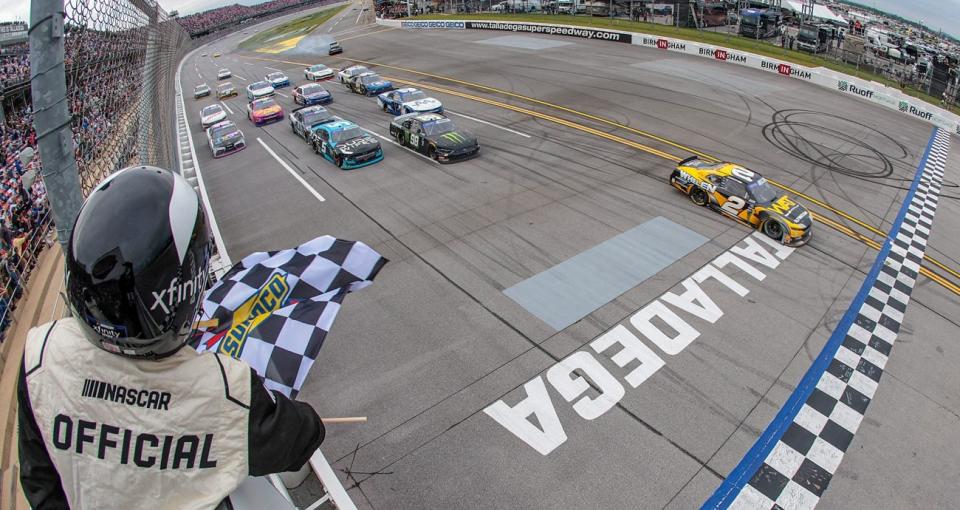 Jesse Love takes the checkered flag to win the NASCAR Xfinity Series race at Talladega.