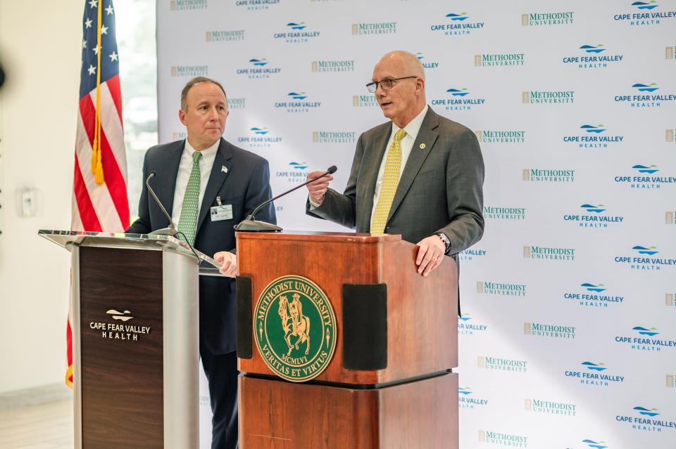 Cape Fear Valley Health CEO Michael Nagowski (left) and Methodist University President Stanley T. Wearden speak during February's announcement of the proposed medical school.