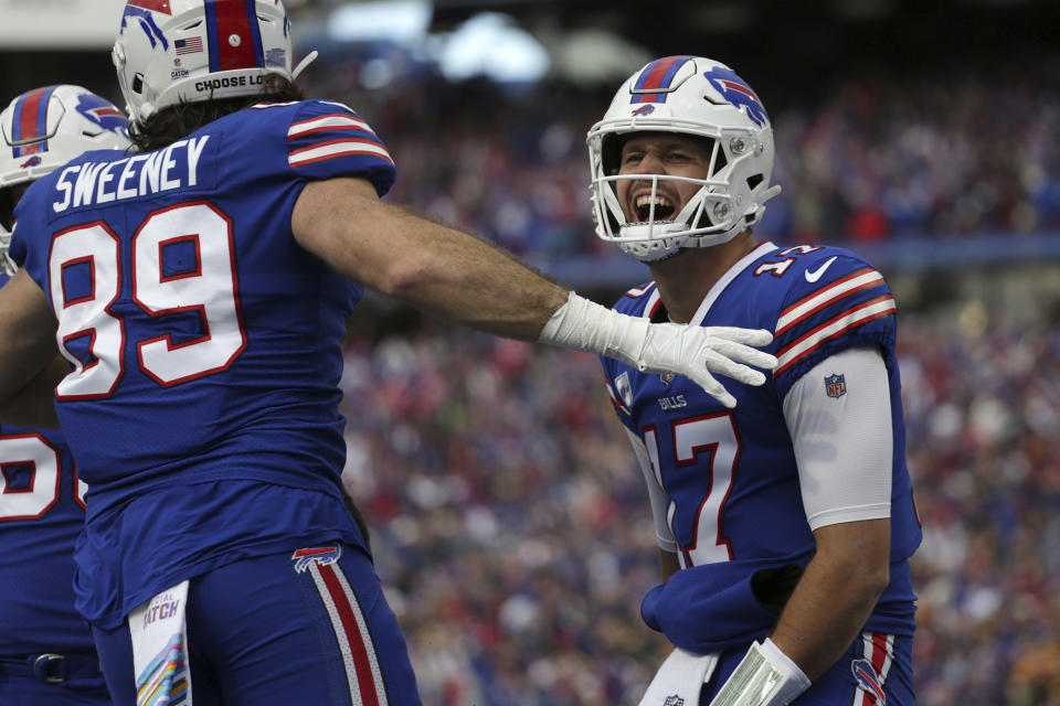 Buffalo Bills quarterback Josh Allen (17) celebrates a touchdown pass to Buffalo Bills wide receiver Gabe Davis during the first half of an NFL football game against the Pittsburgh Steelers in Orchard Park, N.Y., Sunday, Oct. 9, 2022. (AP Photo/Joshua Bessex)