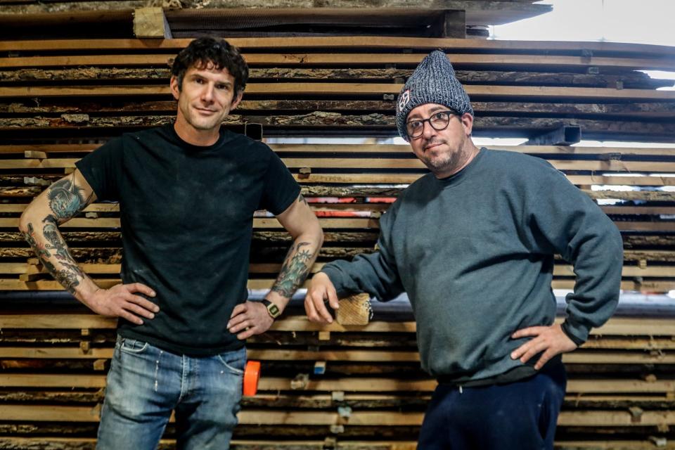 From left, Andy Stewart and Brian Presnell are photographed next to a kiln on Tuesday, March 8, 2022, at Indy Urban Hardwood in Indianapolis. 