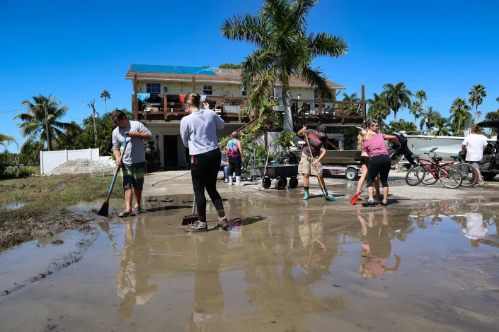 Residents and business owners of Everglades City clean up from Hurricane Ian.