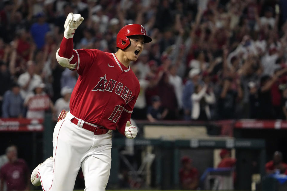 The Angels' Shohei Ohtani celebrates as he rounds first after hitting a two-run home run during the seventh inning Monday against the Yankees. (AP Photo/Mark J. Terrill)