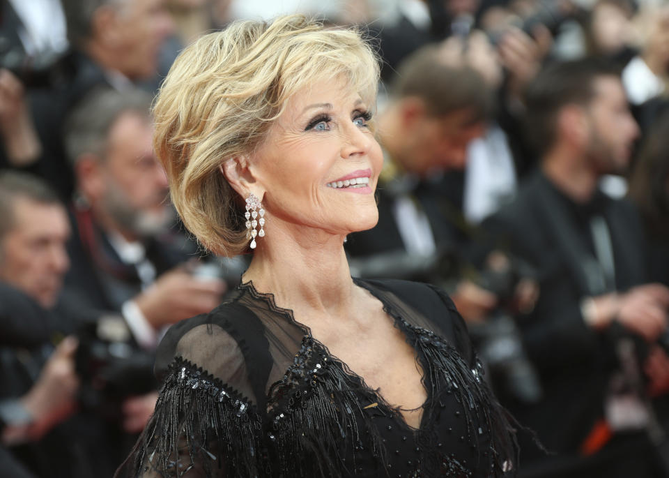 FILE - In this May 13, 2018 file photo, actress Jane Fonda poses for photographers upon arrival at the premiere of the film 'Sink or Swim' at the 71st international film festival, Cannes, southern France. Jane Fonda is joining a group of Hollywood power players to host a fundraiser for Democratic presidential contender Steve Bullock. (Photo by Joel C Ryan/Invision/AP)