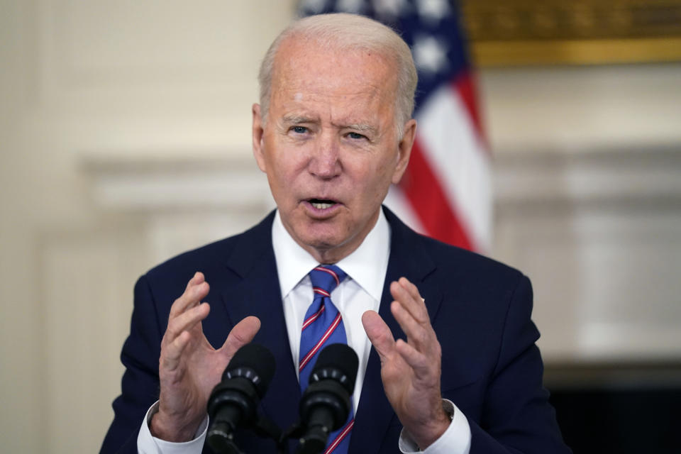 FILE - In this Friday, April 2, 2021 file photo, President Joe Biden speaks about the March jobs report in the State Dining Room of the White House, Friday, April 2, 2021, in Washington. Even though the federal government has spent tens of billions of dollars to close the digital divide, tens of millions of Americans still aren’t online. The Biden administration has now broached a big number, $100 billion, in an effort to get all Americans connected. (AP Photo/Andrew Harnik, File)