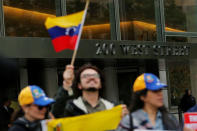 Protesters demonstrate outside of Goldman Sachs headquarters after the company purchased Venezuelan bonds in New York, U.S., May 30, 2017. REUTERS/Lucas Jackson