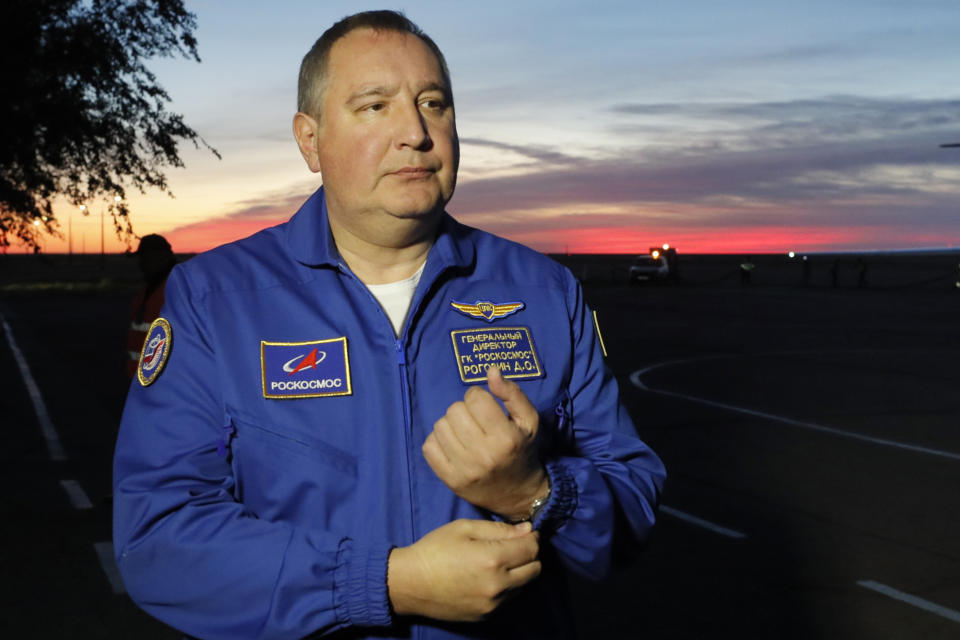 FILE - Director General of the Russia state corporation Roscosmos Dmitry Rogozin walks in Baikonur airport, in Kazakhstan, Oct. 11, 2018. Russian President Vladimir Putin on Friday removed Dmitry Rogozin as the head of state-controlled Roscosmos space agency that oversees the country's space program and includes rocket factories, launch facilities and numerous other assets. (Yuri Kochetkov/Pool Photo via AP, File)
