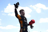 Pato O'Ward celebrates after winning the second race of the IndyCar Detroit Grand Prix auto racing doubleheader on Belle Isle in Detroit, Sunday, June 13, 2021. (AP Photo/Paul Sancya)